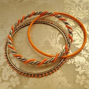 NWOT Three Orange /Gold Bangles